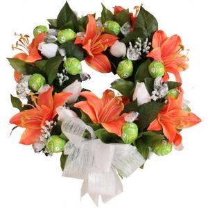 This gorgeous wreath is made up of artificial lillies, greenery, Rose buds & 13 lindt chocolates. More colours available.
